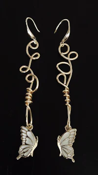 a pair of gold - plated butterfly earrings