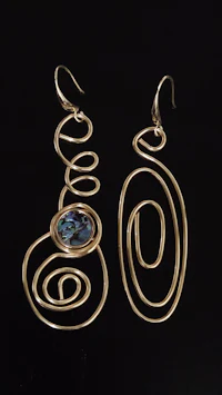a pair of gold - plated earrings with an abalone stone