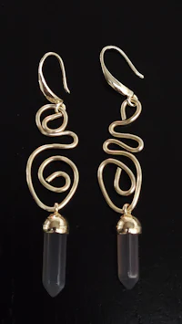 a pair of gold plated earrings with a quartz stone